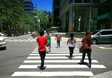 Premium Photo Rear View Of People Walking On Road In City