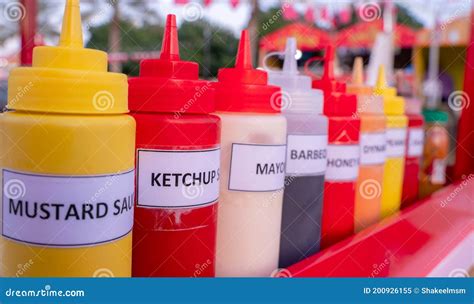 Multiple Flavor Sauce Bottles In A Food Card At A Food Festival