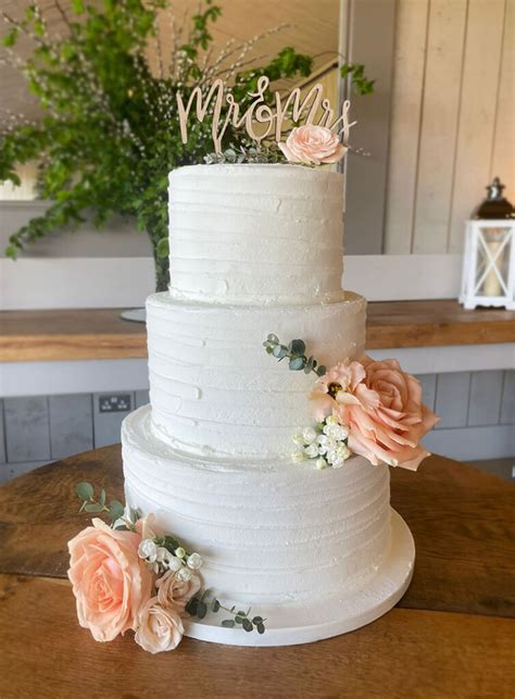 Rustic Iced Wedding Cake With Peach Roses The Cakery Leamington Spa