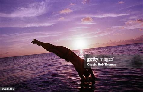 Man Diving Silhouette Photos And Premium High Res Pictures Getty Images