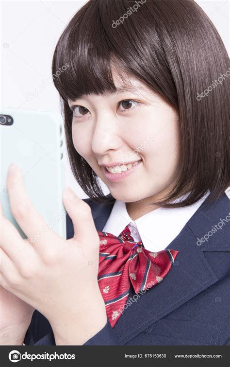 Studio Portrait Smiling Japanese Schoolgirl Using Smartphone — Stock