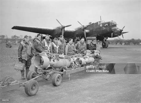 The bombs and crew of a Halifax bomber before a sortie into enemy ...