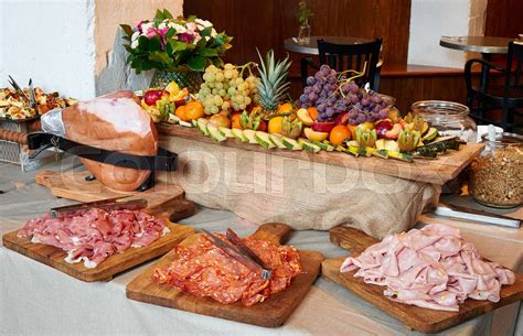 Colored Buffet With Seasonal Fresh Fruits And Different Kind Of Ham