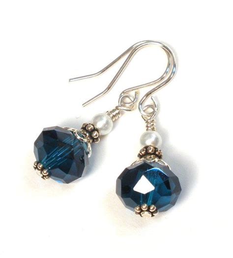 These Earrings Were Handmade With Teal Blue Crystal Rondelles Accented With Silver Plated Beads