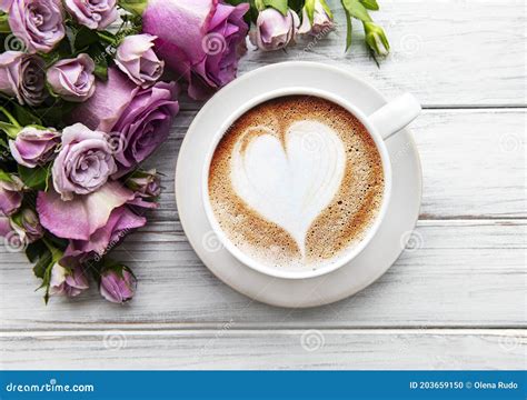 Morning Cup Of Coffee And Beautiful Rose Flowers On A Light Background