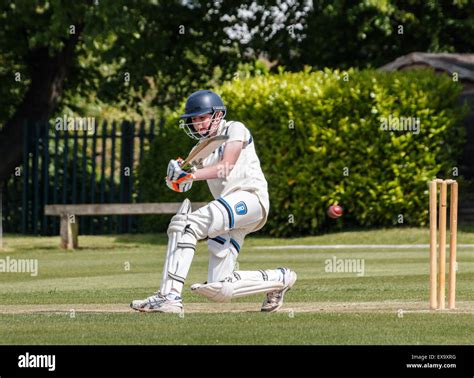 A Teenage Batsman Plays A Shot Whilst Batting During A School Cricket