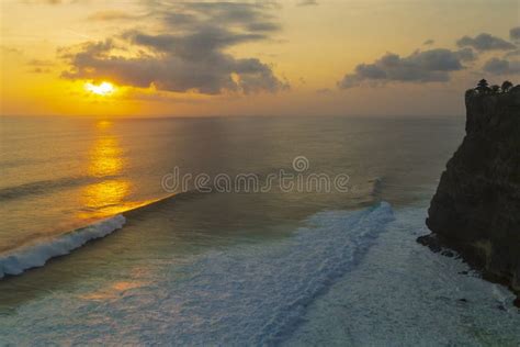 Pura Luhur Uluwatu Temple in Sunset View . Amazing Landscape - Cliff with Sunset Sky and Ocean ...