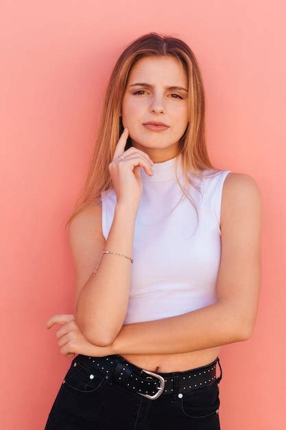 Free Photo Close Up Of Young Womans Face Looking Up Against Blue