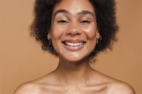 Black Curly Shirtless Woman Smiling And Looking At Camera Stock Photo