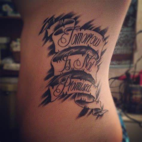 A Womans Lower Back Tattoo With The Words Tomorrow Is No Princess On It