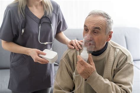 Elderly Senior Man Nursing Care Wear Oxygen Inhaler Device For Helping