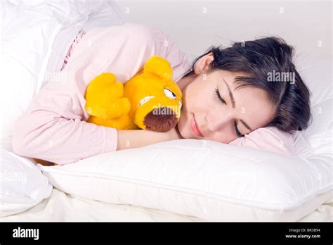 girl sleeping with teddy bear in bed Stock Photo - Alamy