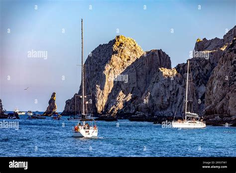 Boats Sailing Towards Cabo San Lucas Arch And Love Beach In The Sea Of