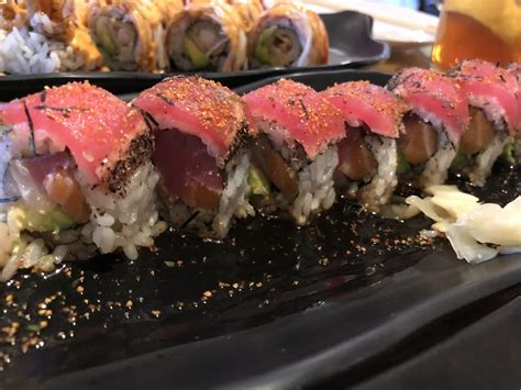 Black Pepper Tuna On Top Of Spicy Tuna Roll Sushi