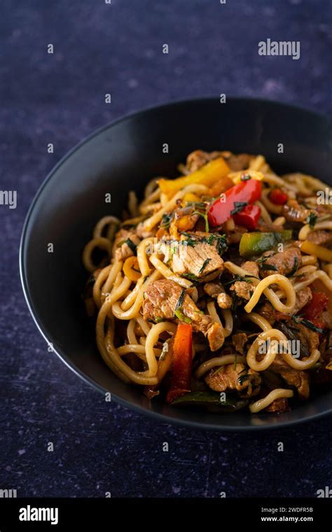Pork Loin With Bell Peppers And Udon Noodles Stock Photo Alamy