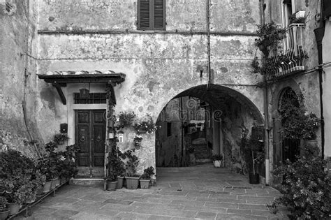 Stone Houses On A Paved Street In A Small Town In Tuscany Stock Photo