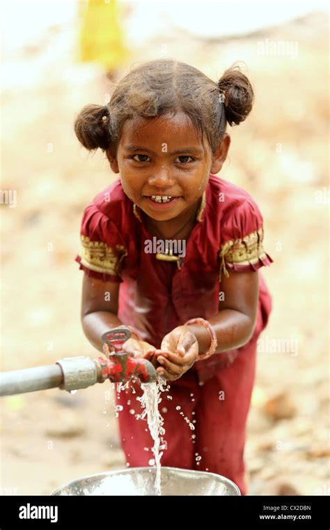 Indian kid washing hands hi-res stock photography and images - Alamy