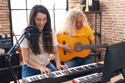 Two Women Musicians Singing Song Playing Classical Guitar And Piano At