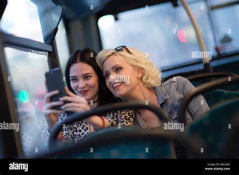 Female Friends Taking A Selfie On A London Bus Stock Photo Alamy