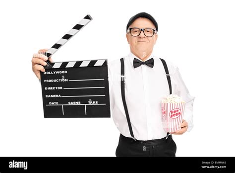 Mature Movie Director Holding A Clapperboard And A Box Of Popcorn