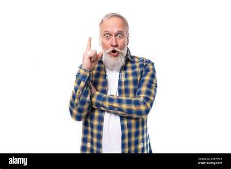 Smart Mature Gray Haired Man With A Beard In A Shirt Has An Idea On A White Background Stock