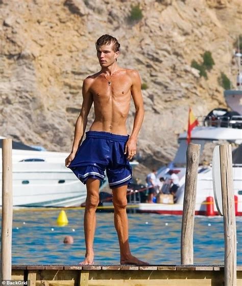 Shirtless Jordan Barrett Enjoys A Cooling Dip In The Sea With Pals