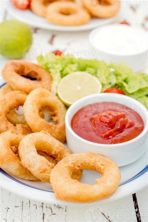 Fried squid rings 22934942 Stock Photo at Vecteezy