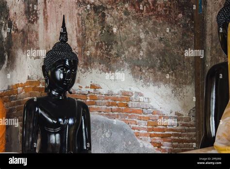 Black Buddha Statue With Old Walls In Thai Temples Stock Photo Alamy