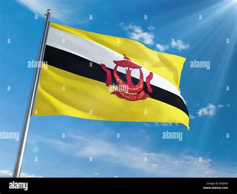 Brunei National Flag Waving On Pole Against Sunny Blue Sky Background