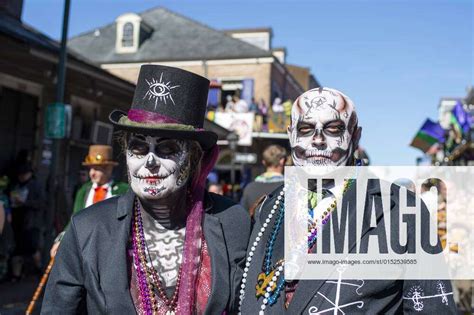 People Dress In Costumes And Beads To Celebrate Mardi Gras On Bourbon