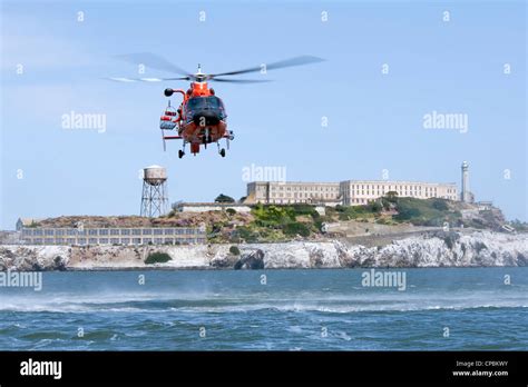A United States Coast Guard Hh 65c Dolphin Helicopter Approaching A