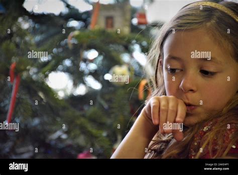 7 Year Old Girl At Christmas Time With Real Presents Some For Her