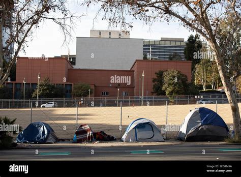 A homeless encampment sits on a street in Downtown Los Angeles ...