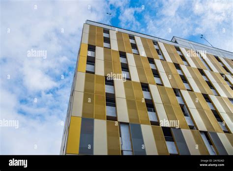 Contrasting Colors And Shapes On Building Facade Against The Sky In