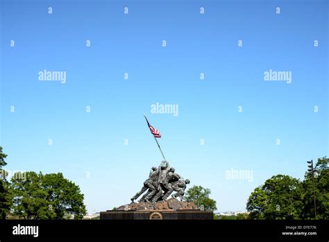 The Statue Against A Blue Sky At The Iwo Jima Memorial Formally The