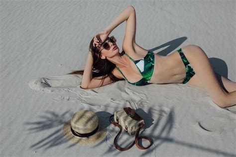 Premium Photo Sexy Girl In The Sand In A White Bikini