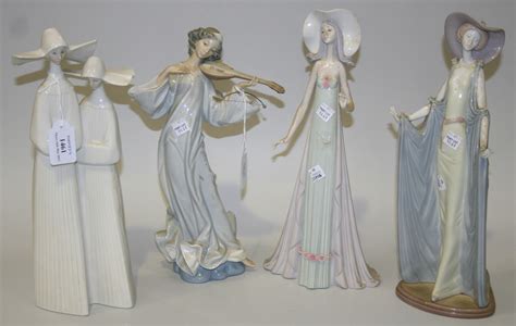 A Lladro Porcelain Figure Group Of Two Nuns Model No 4611 Together