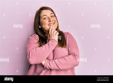 Beautiful Brunette Plus Size Woman Wearing Casual Winter Sweater Smiling Looking Confident At