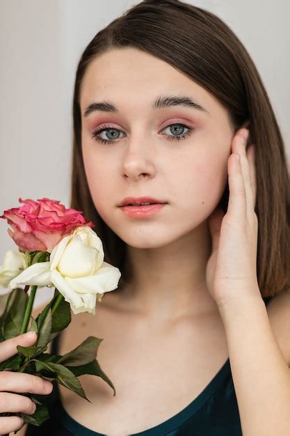 Premium Photo Portrait Of Beautiful Dark Haired Woman With Flowers