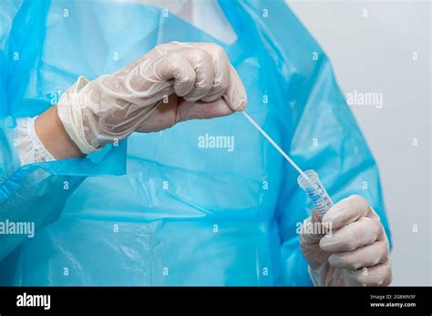 A Medical Worker Holding A Swab Sample Collection Kit Stock Photo Alamy