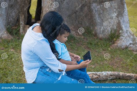 Mom And Son Watching The Tablet Stock Image Image Of Latinos