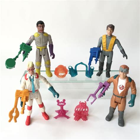 toy action figures are displayed on a glass shelf