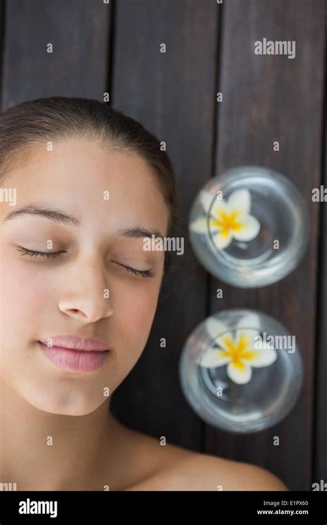 Peaceful Brunette Lying With Eyes Closed Stock Photo Alamy