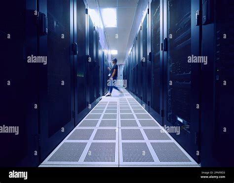 Female Technician Walking In Server Room Stock Photo Alamy