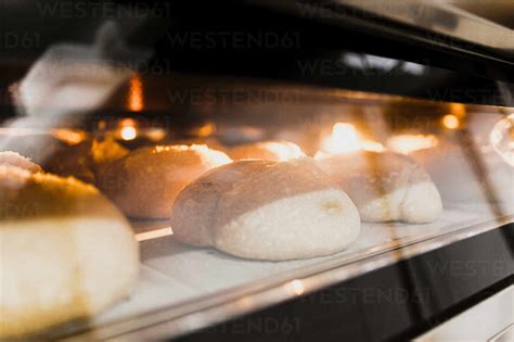 Close Up Of Baked Bread In Oven Stock Photo