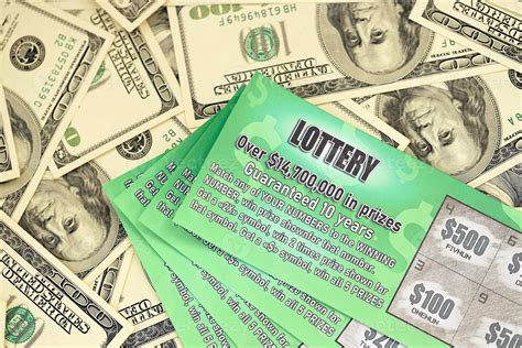 Close up view of green lottery scratch cards and us dollar bills. Many ...