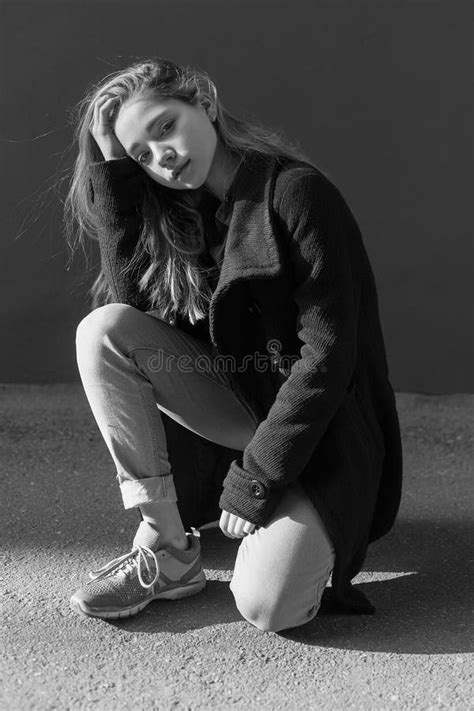 Black And White Portrait Of Sad Lonely Young Girl With Long Hair In