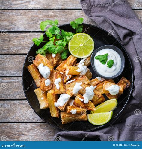 Fried Yucca Yuca Cassava Manioca Mandioca With Cilantro Sauce Stock