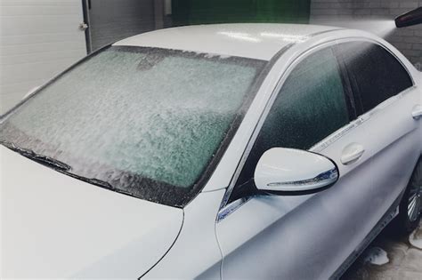 Premium Photo Close Up Cleaning Car Using High Pressure Waterhigh