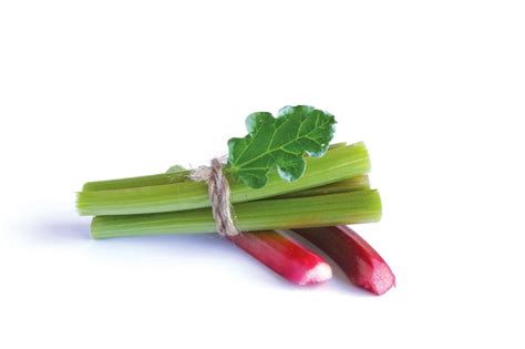 Premium Photo Red And Green Rhubarb Stalks With A Green Leaf Tied